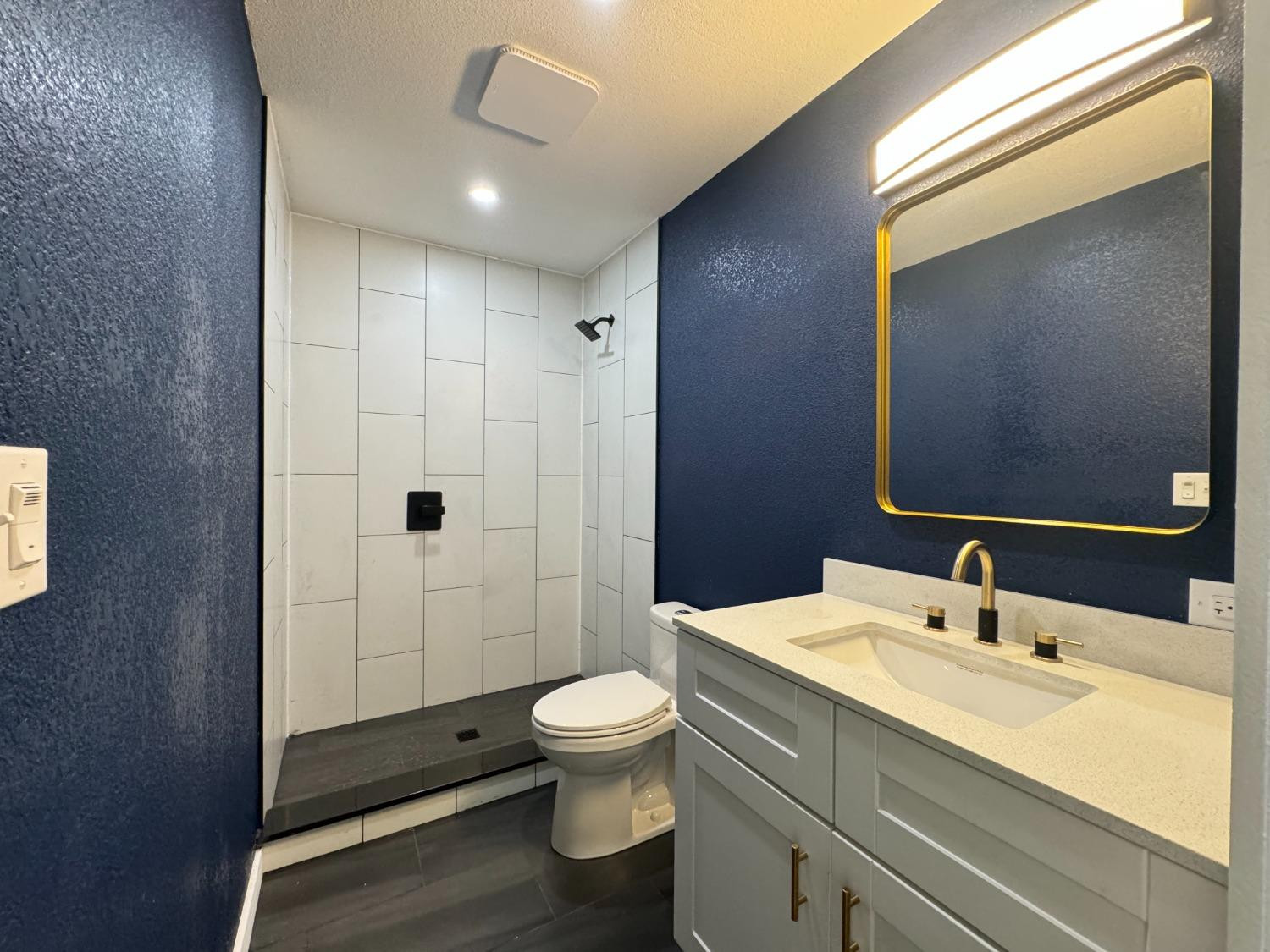 3410 40th Street Lubbock, TX 79413 - Photo 41 of 45 a bathroom with a sink a toilet and shower