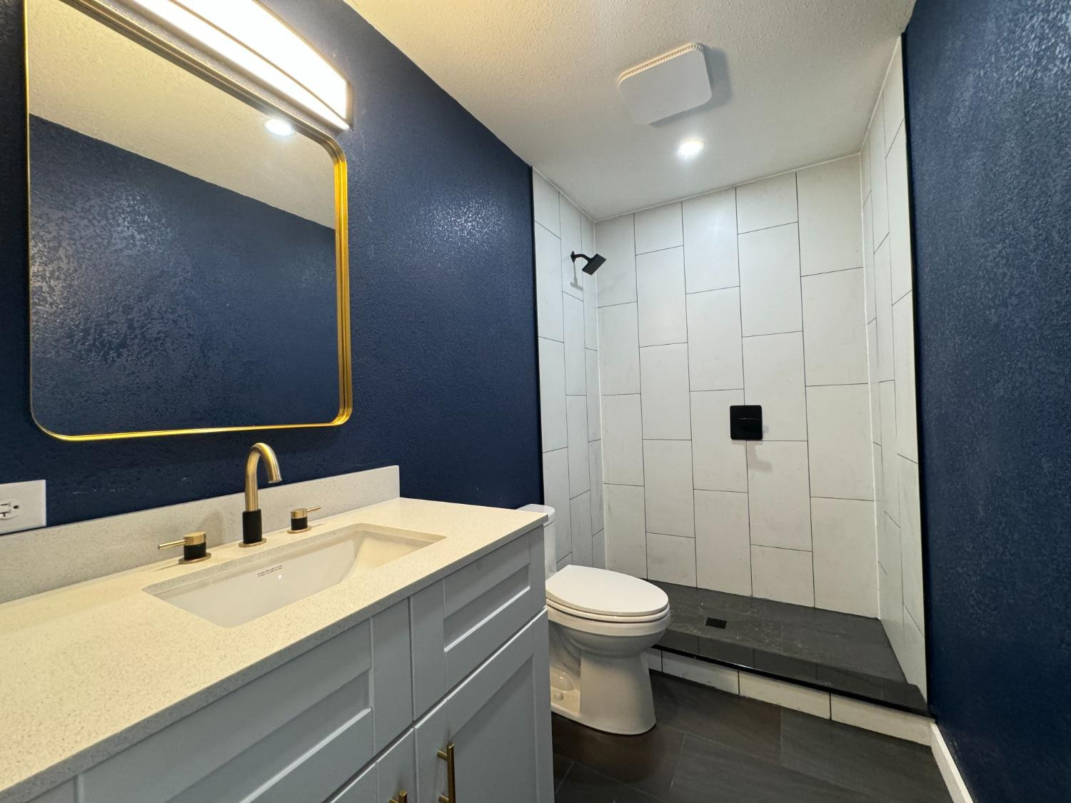 3410 40th Street Lubbock, TX 79413 - Photo 45 of 45 a bathroom with a toilet sink and shower