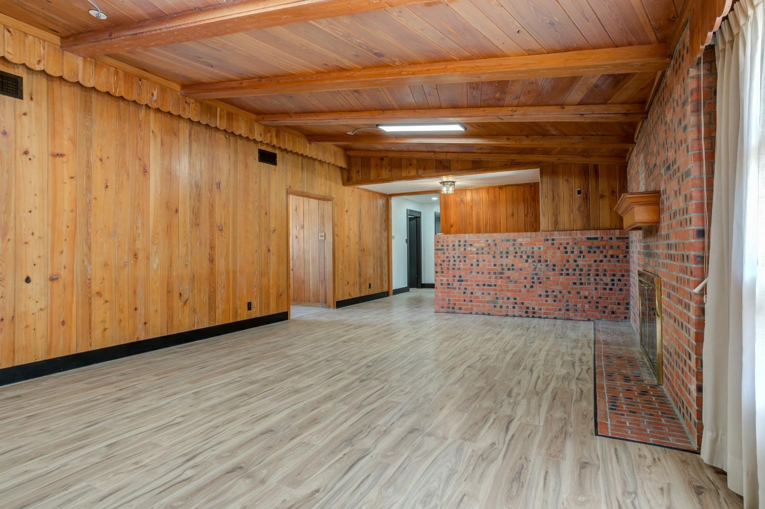 3410 40th Street Lubbock, TX 79413 - Photo 10 of 45 a view of empty room with wooden floor and entryway