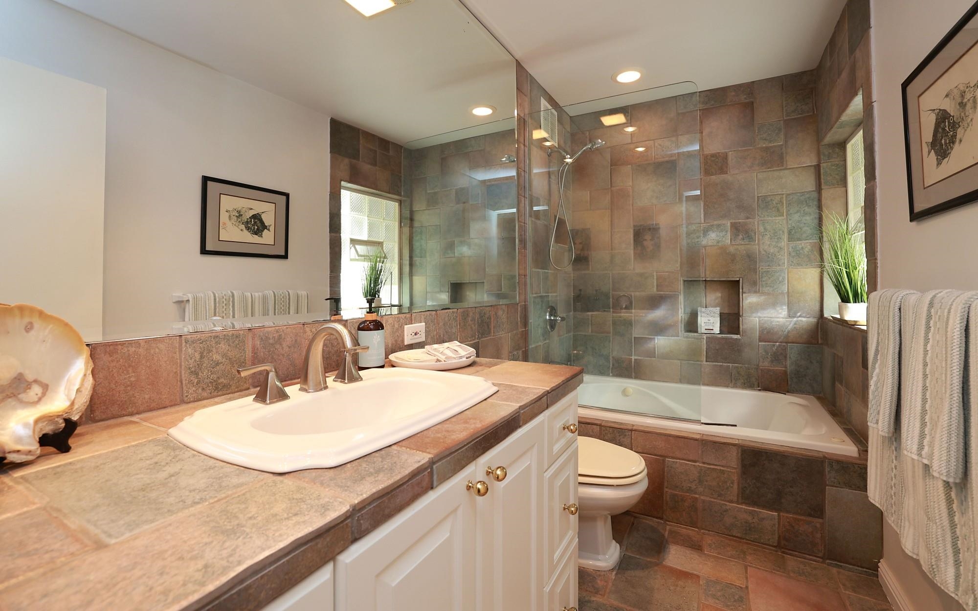 5045 Lower Honoapiilani Road, Unit 2 Lahaina, HI 96761 - Photo 11 of 37 a bathroom with a sink a toilet and shower