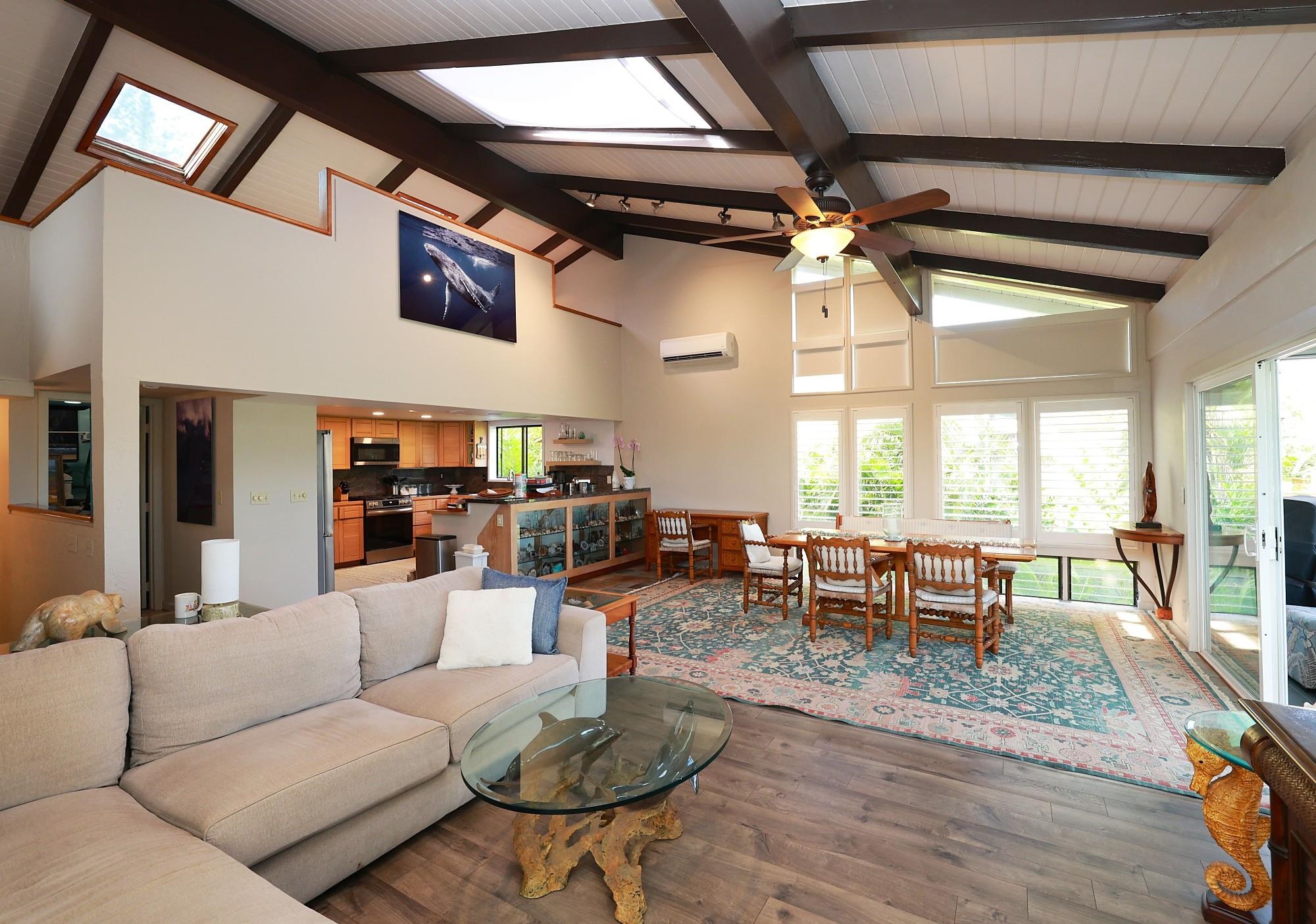 5045 Lower Honoapiilani Road, Unit 2 Lahaina, HI 96761 - Photo 15 of 37 a living room with furniture dining table and a large window