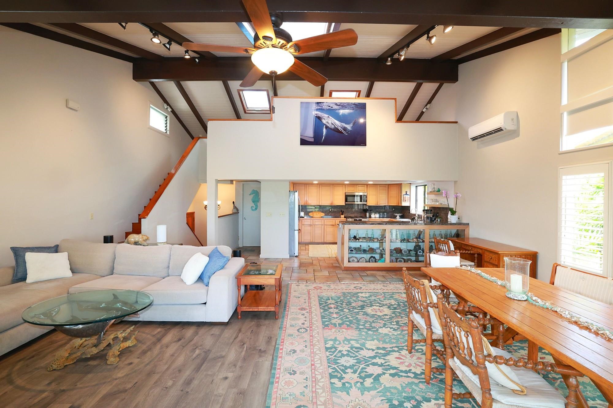 5045 Lower Honoapiilani Road, Unit 2 Lahaina, HI 96761 - Photo 16 of 37 a living room with furniture and a table