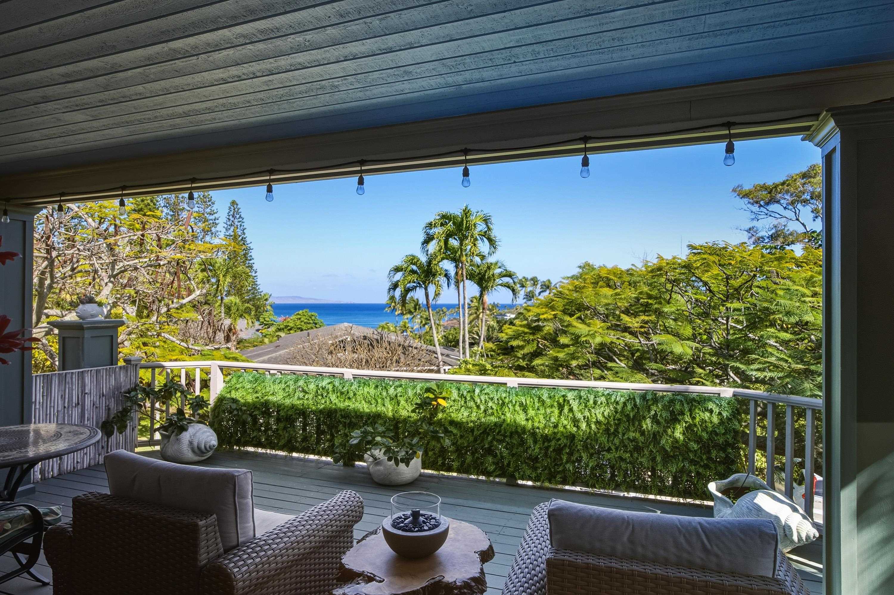 5045 Lower Honoapiilani Road, Unit 2 Lahaina, HI 96761 - Photo 2 of 37 a view of a chairs and table in a patio