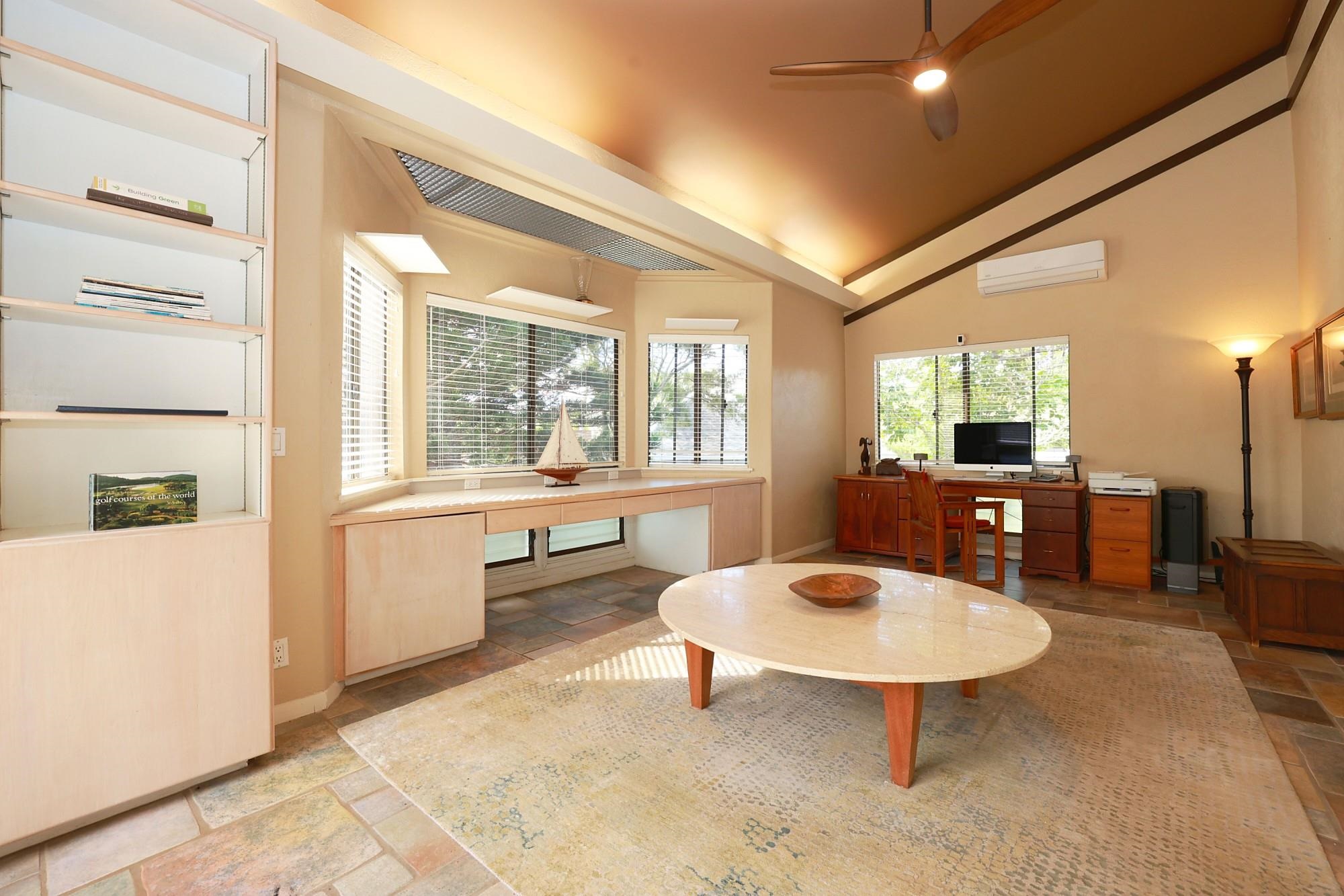 5045 Lower Honoapiilani Road, Unit 2 Lahaina, HI 96761 - Photo 21 of 37 a living room with furniture a table and a large window