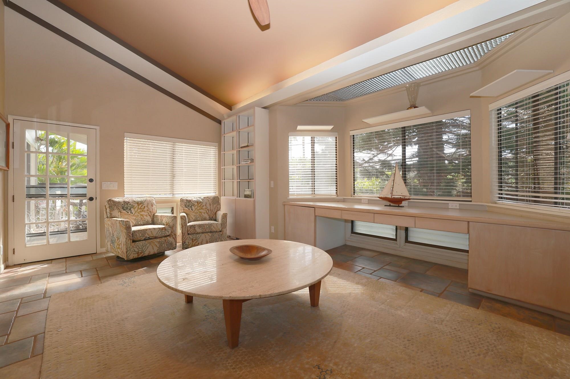 5045 Lower Honoapiilani Road, Unit 2 Lahaina, HI 96761 - Photo 22 of 37 a living room with furniture and a large window