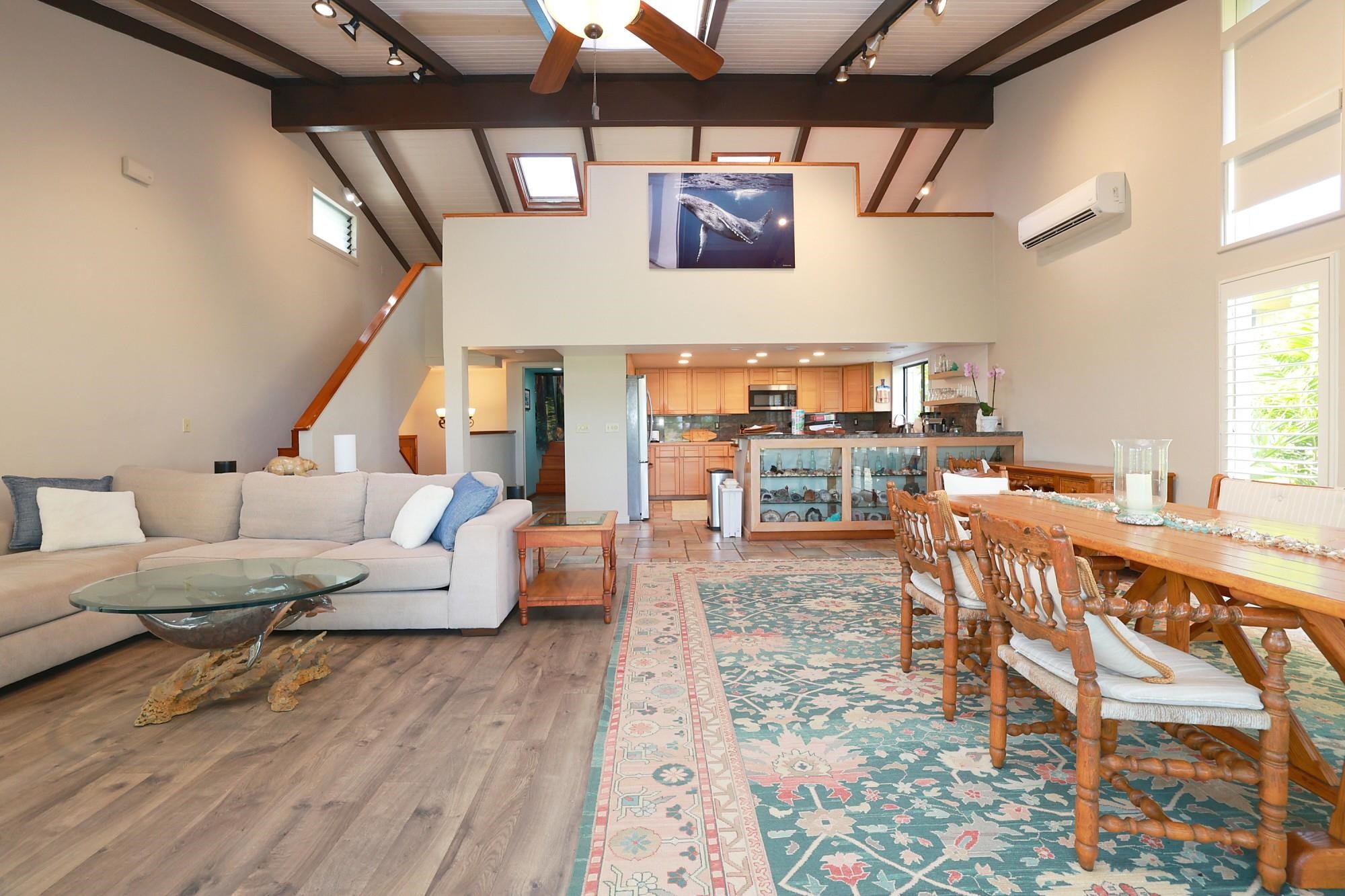 5045 Lower Honoapiilani Road, Unit 2 Lahaina, HI 96761 - Photo 3 of 37 a living room with lots of furniture and a wooden floor