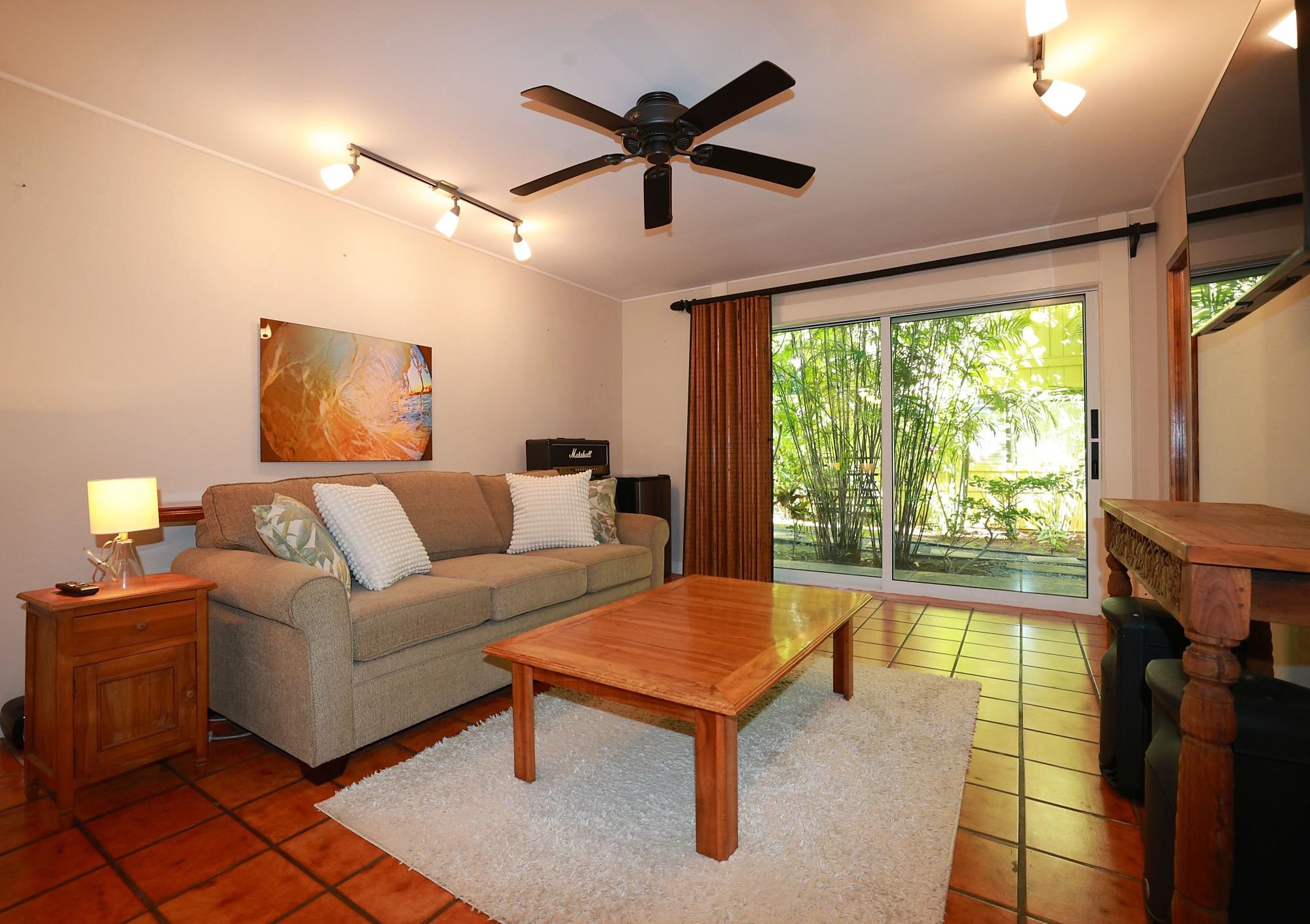5045 Lower Honoapiilani Road, Unit 2 Lahaina, HI 96761 - Photo 33 of 37 a living room with furniture and a large window