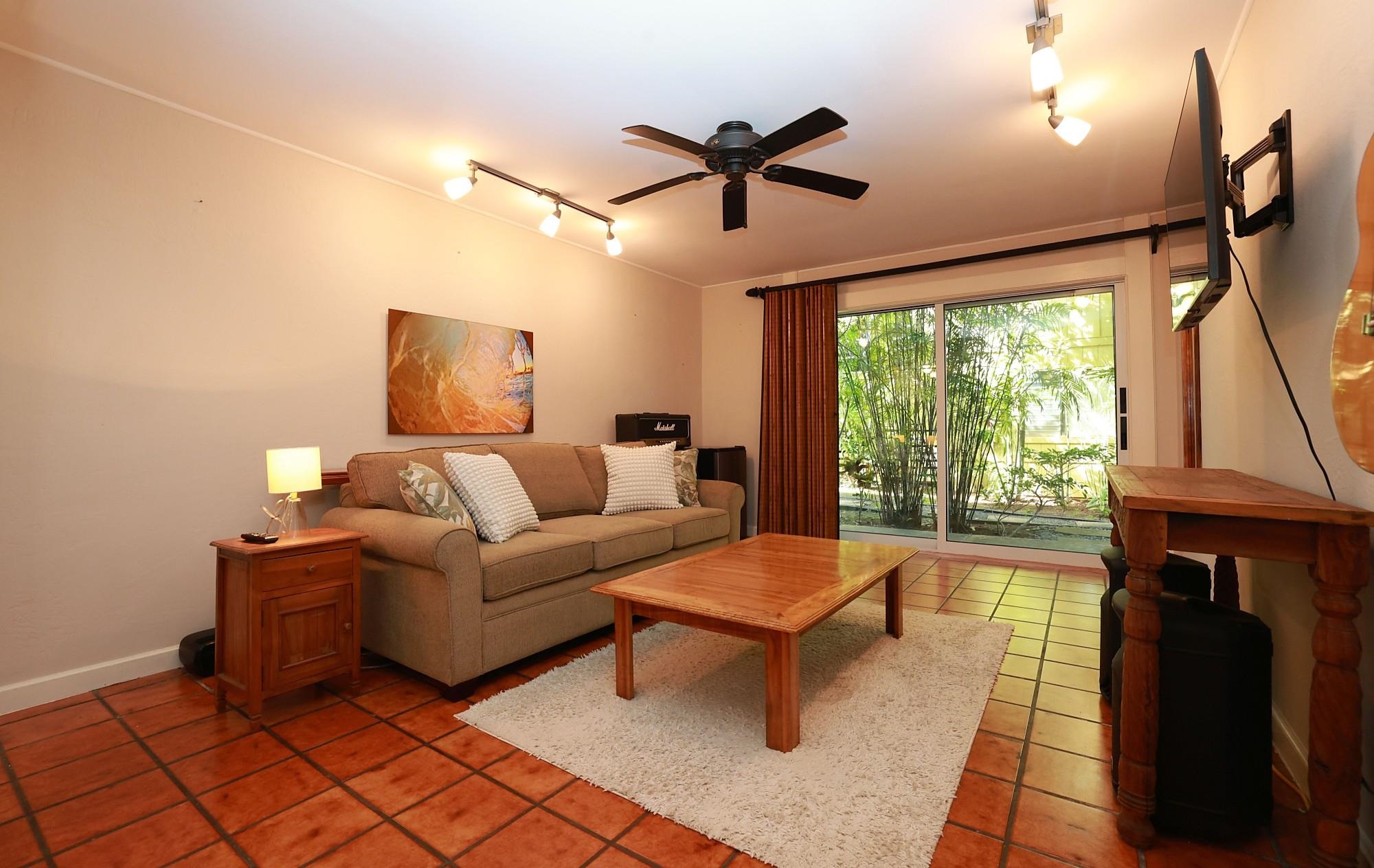 5045 Lower Honoapiilani Road, Unit 2 Lahaina, HI 96761 - Photo 34 of 37 a living room with furniture and a window