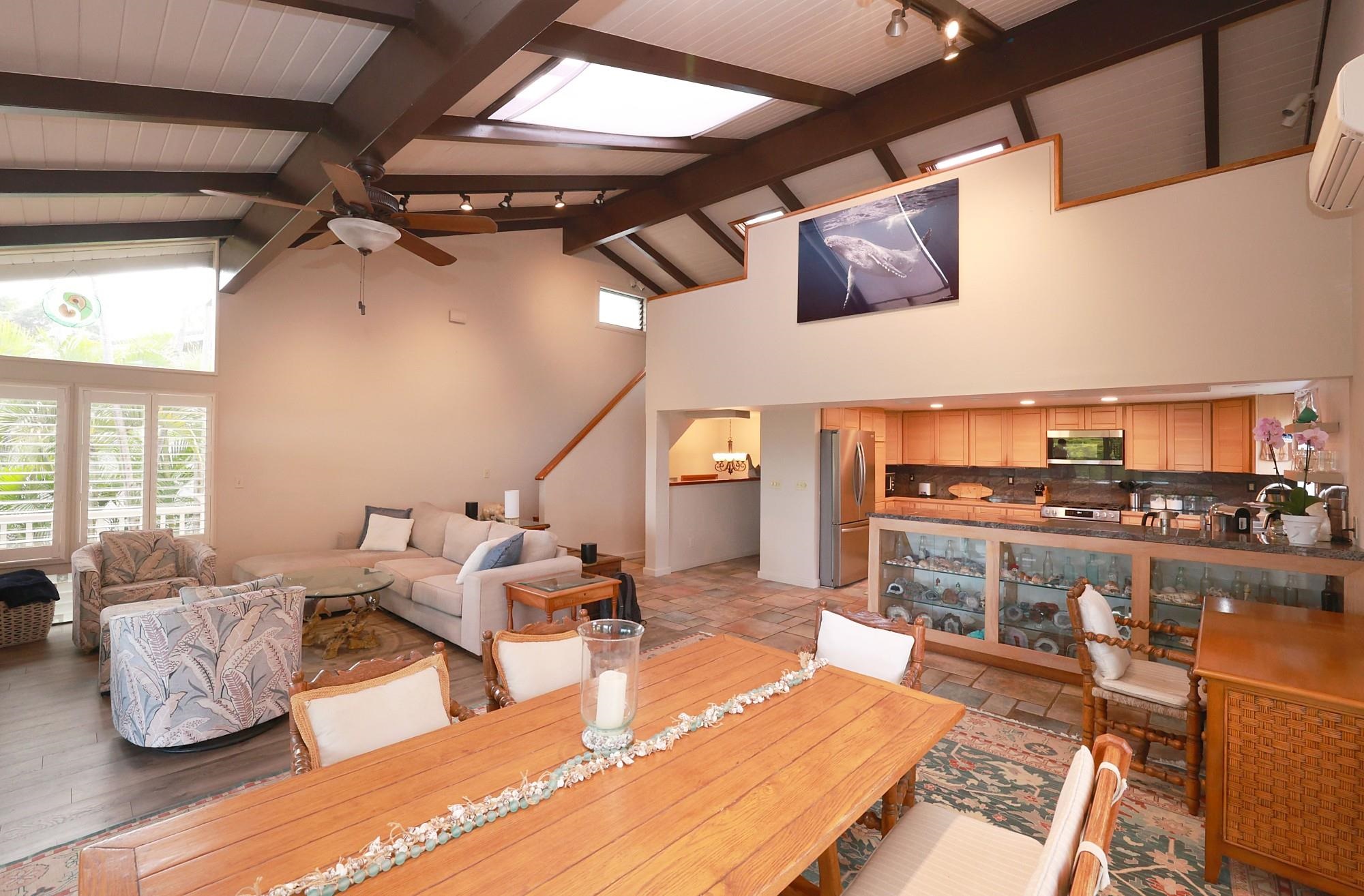 5045 Lower Honoapiilani Road, Unit 2 Lahaina, HI 96761 - Photo 4 of 37 a living room with furniture and a view of kitchen