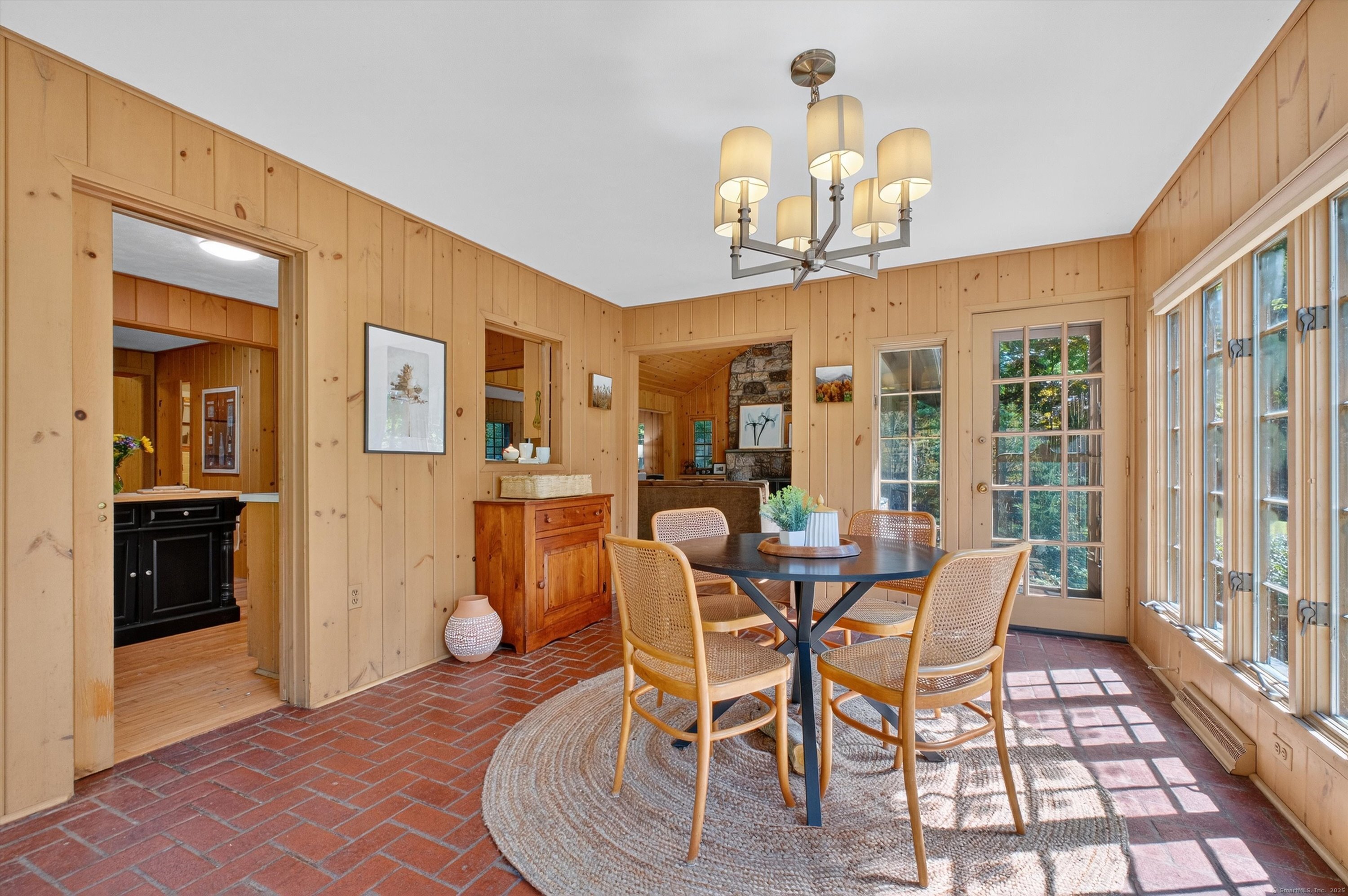45 Indian Trail Brookfield, CT 06804 - Photo 16 of 40 a dining room with furniture a chandelier and wooden floor