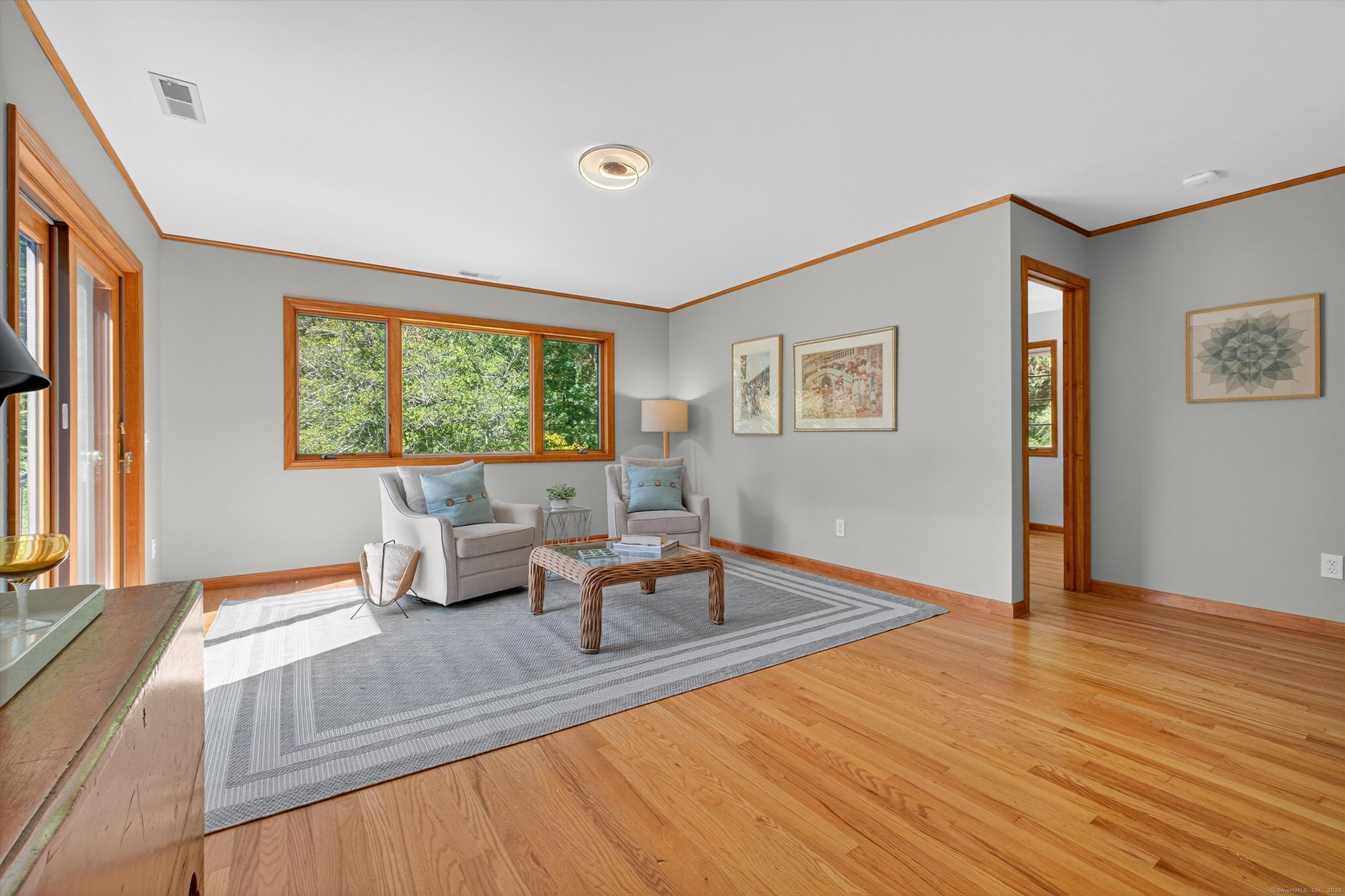 45 Indian Trail Brookfield, CT 06804 - Photo 21 of 40 a living room with furniture and large windows