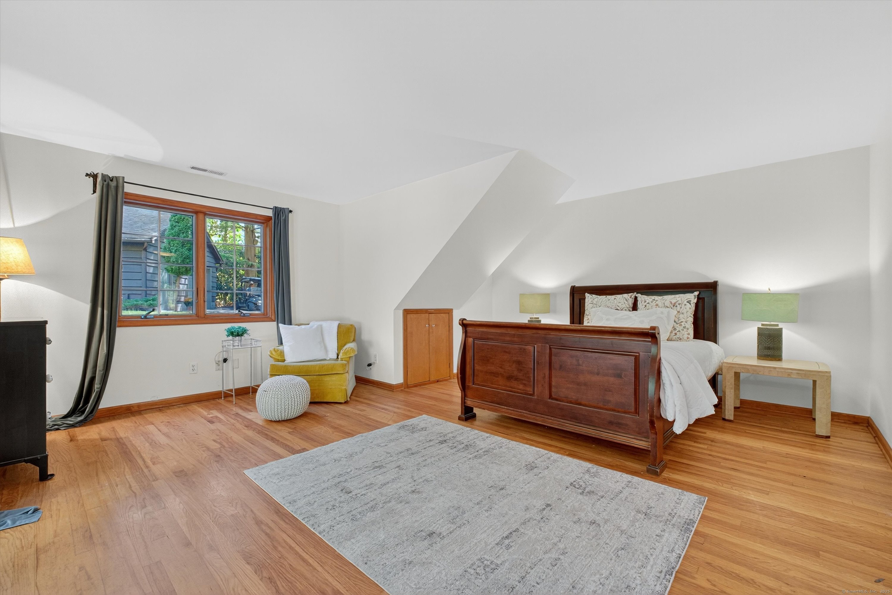 45 Indian Trail Brookfield, CT 06804 - Photo 24 of 40 a bedroom with a bed and wooden floor