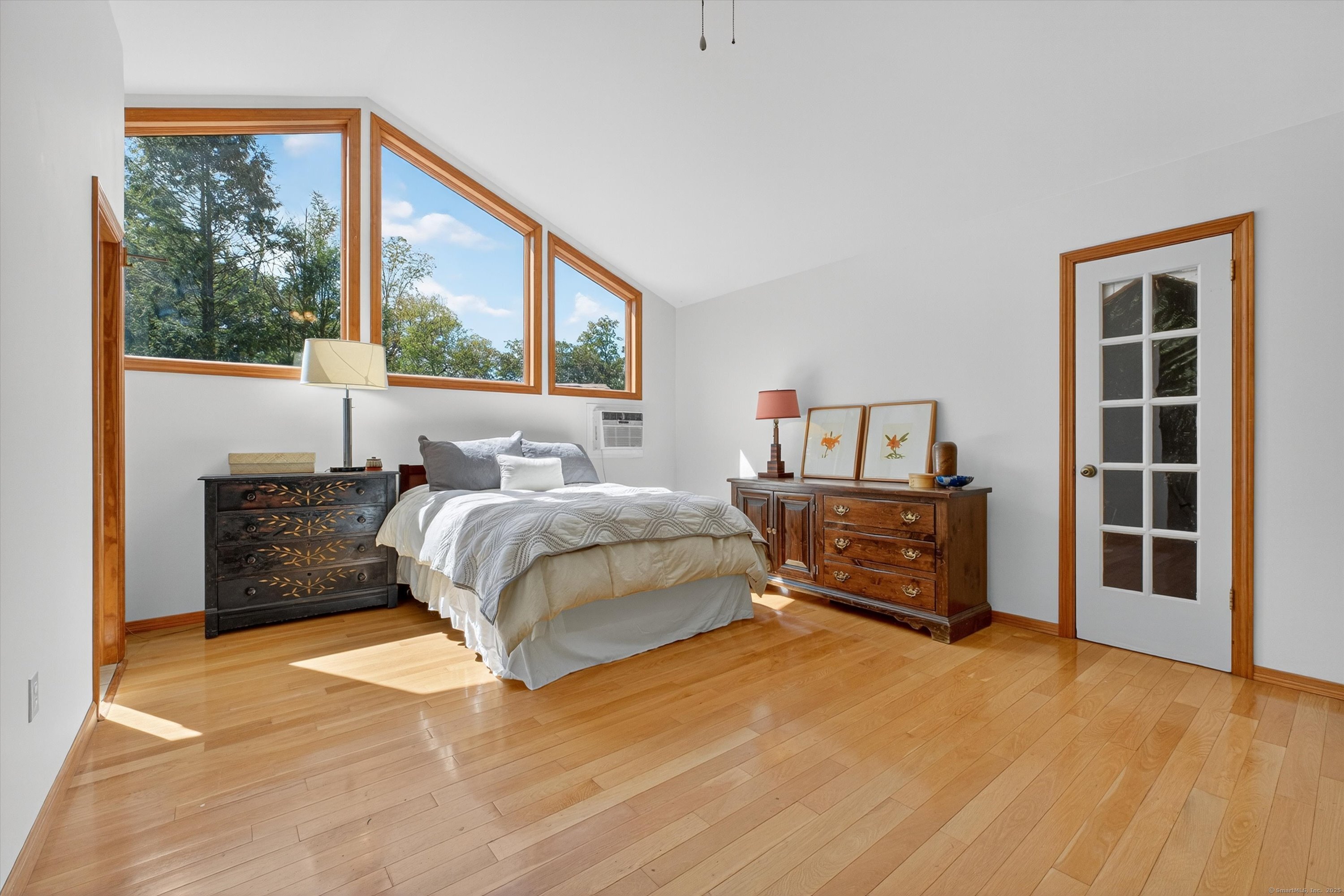 45 Indian Trail Brookfield, CT 06804 - Photo 28 of 40 a bedroom with a bed and a large window