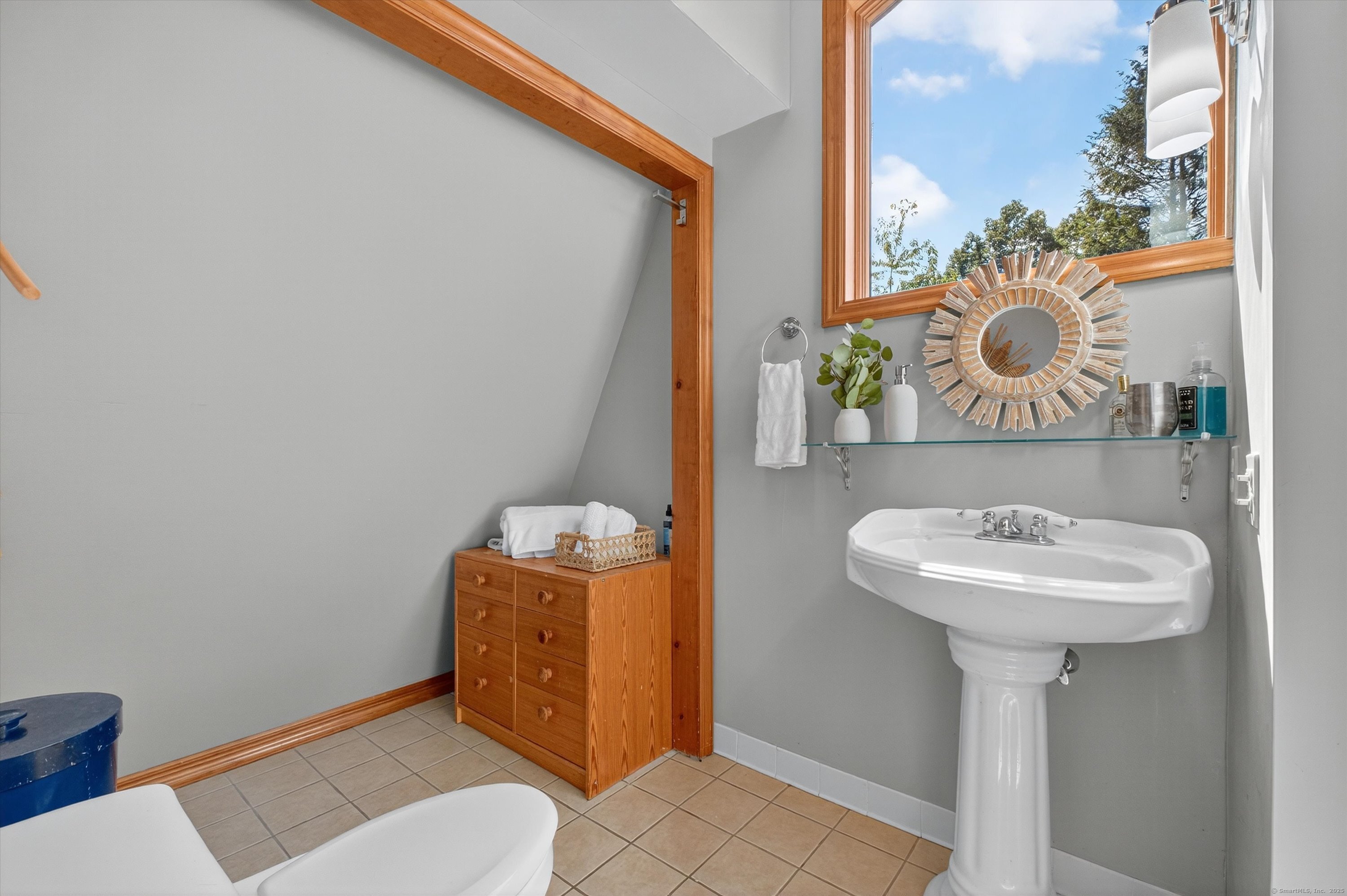45 Indian Trail Brookfield, CT 06804 - Photo 29 of 40 a bathroom with a sink mirror and toilet