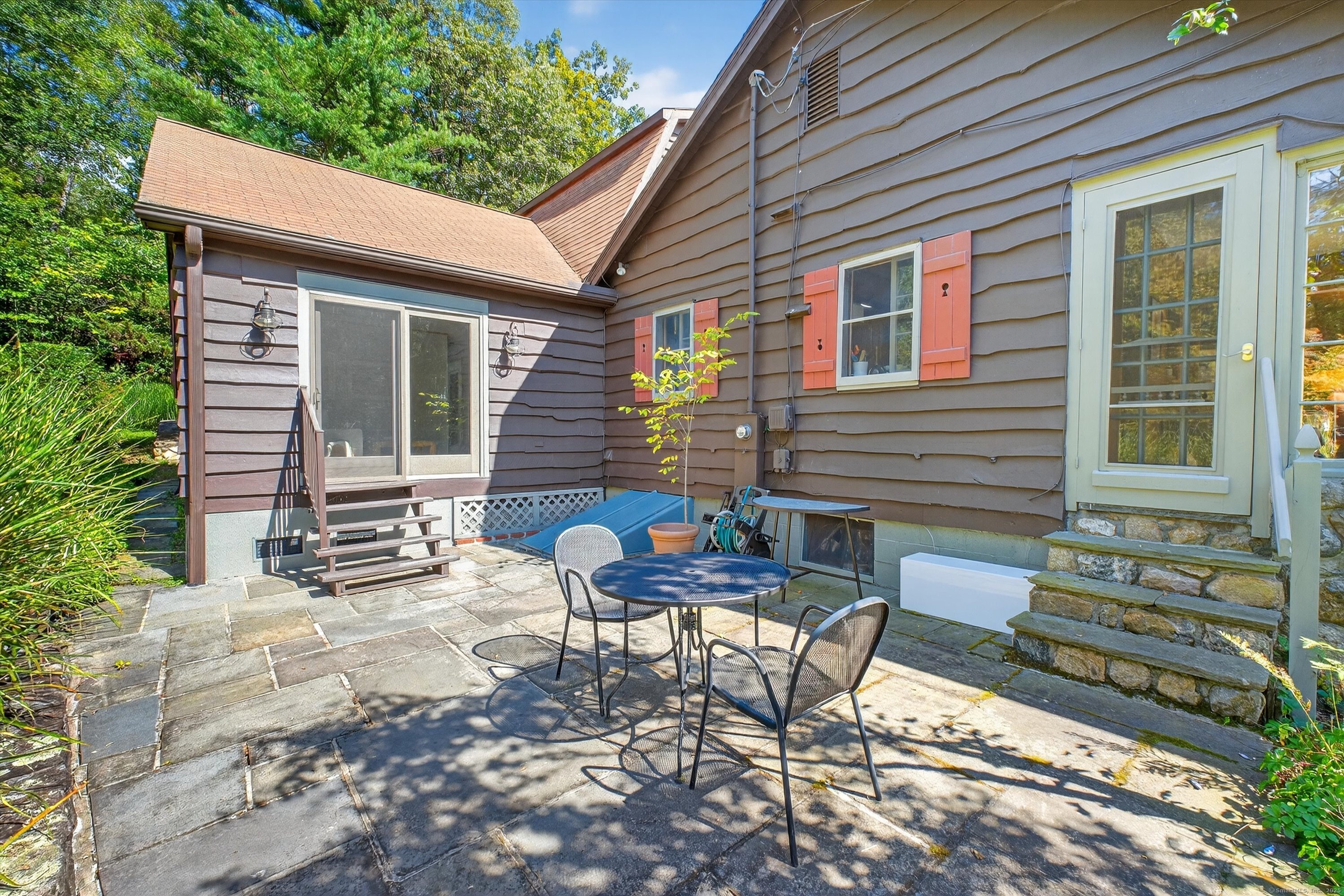 45 Indian Trail Brookfield, CT 06804 - Photo 31 of 40 a view of a chairs and table in backyard of the house