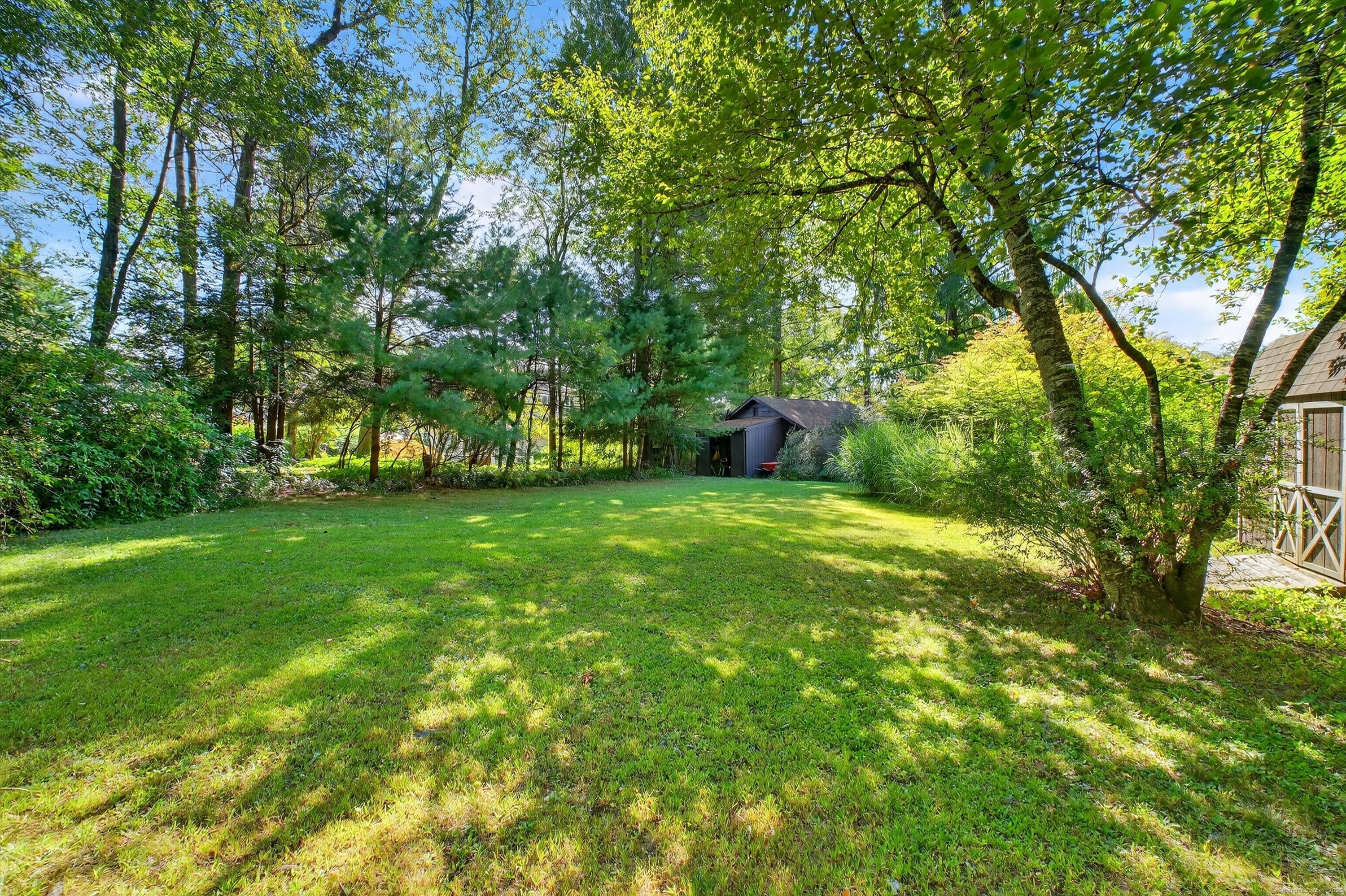 45 Indian Trail Brookfield, CT 06804 - Photo 36 of 40 a view of green field with trees in the background
