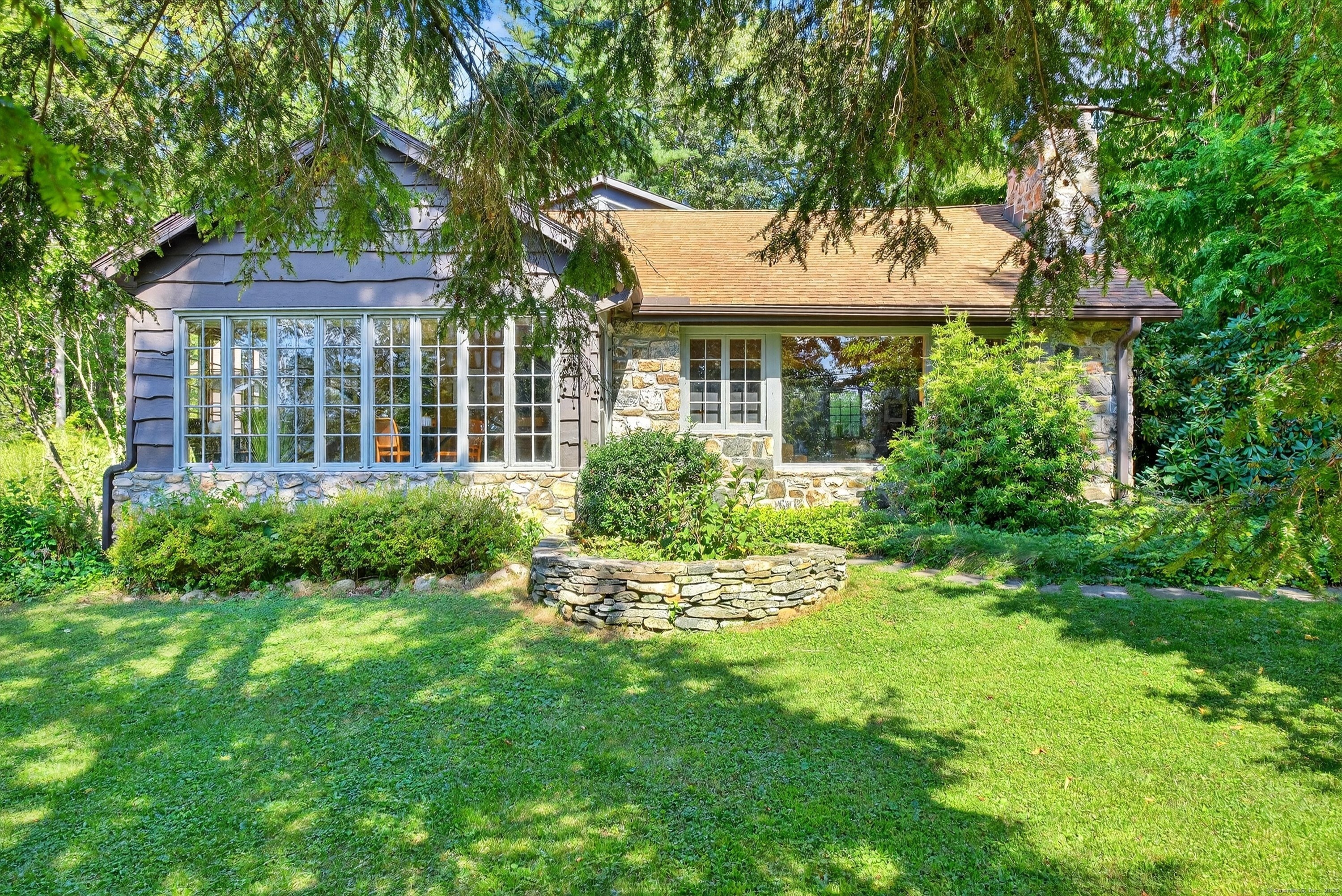 45 Indian Trail Brookfield, CT 06804 - Photo 6 of 40 a front view of a house with a garden