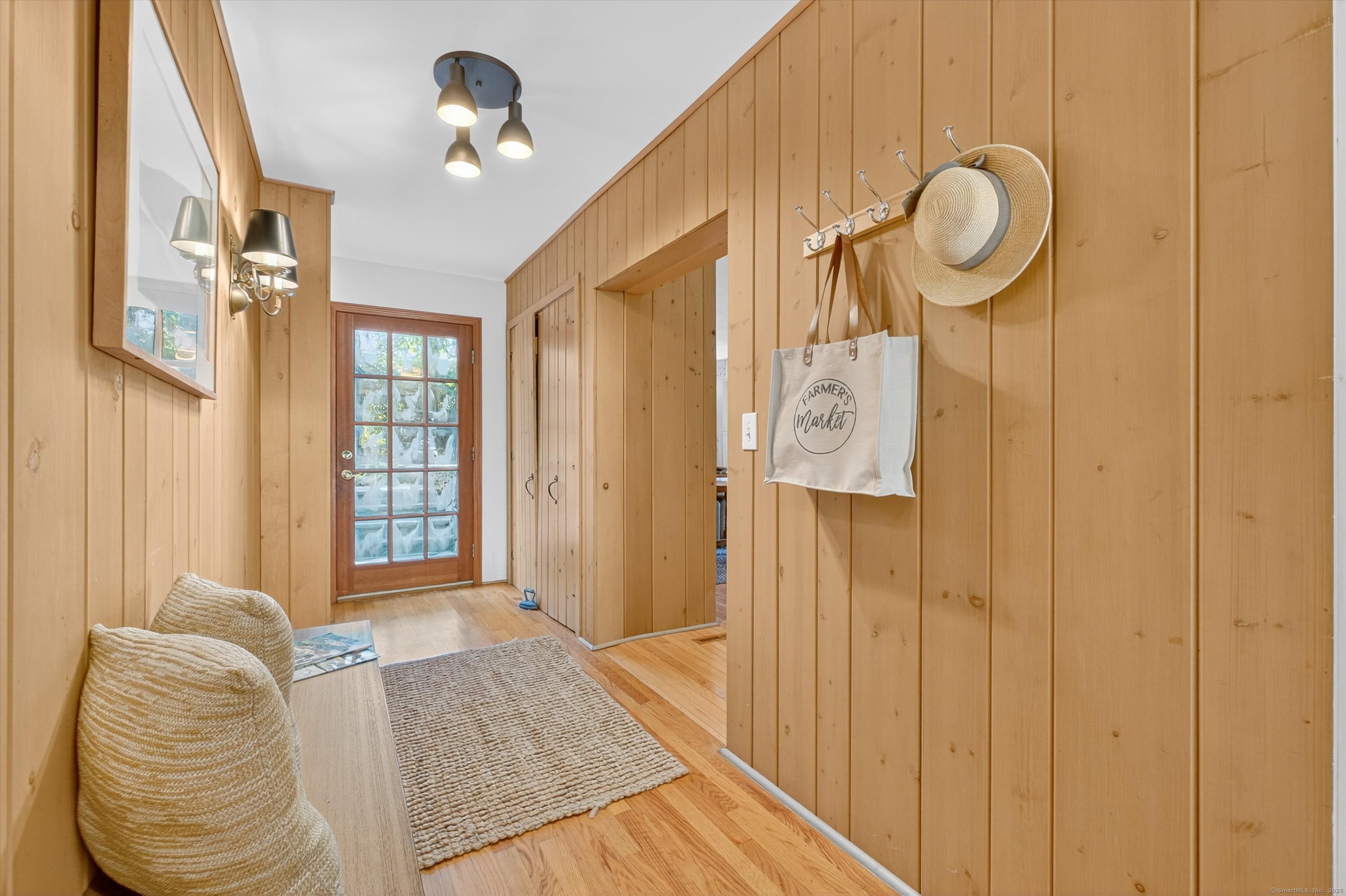 45 Indian Trail Brookfield, CT 06804 - Photo 8 of 40 a bedroom with bed and a chandelier