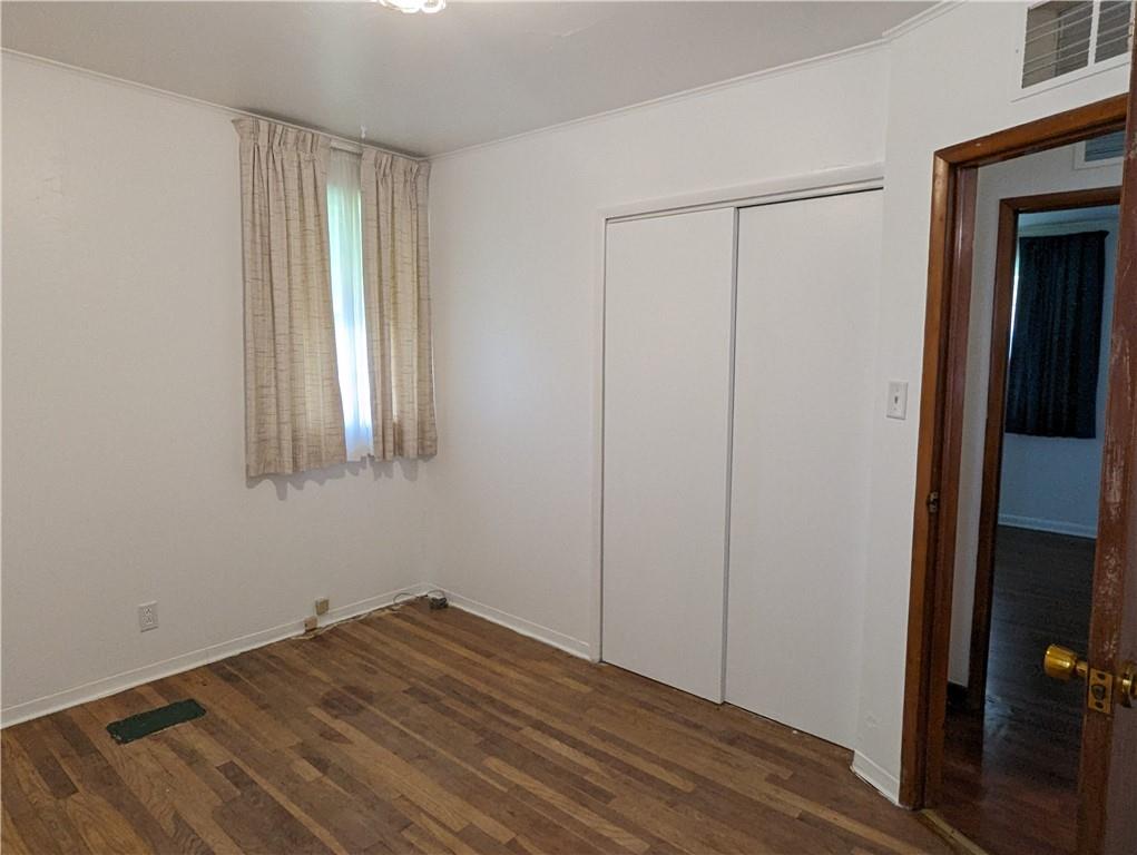 1154 Mars-Evans City Road Mars, PA 16046 - Photo 14 of 17 a view of empty room with wooden floor and fan