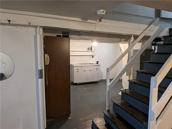 a view of entryway with stairs and a window