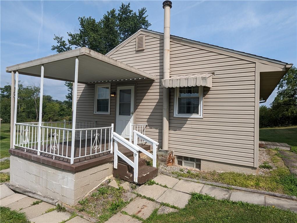 1154 Mars-Evans City Road Mars, PA 16046 - Photo 4 of 17 a view of a white house with a white roof and a deck