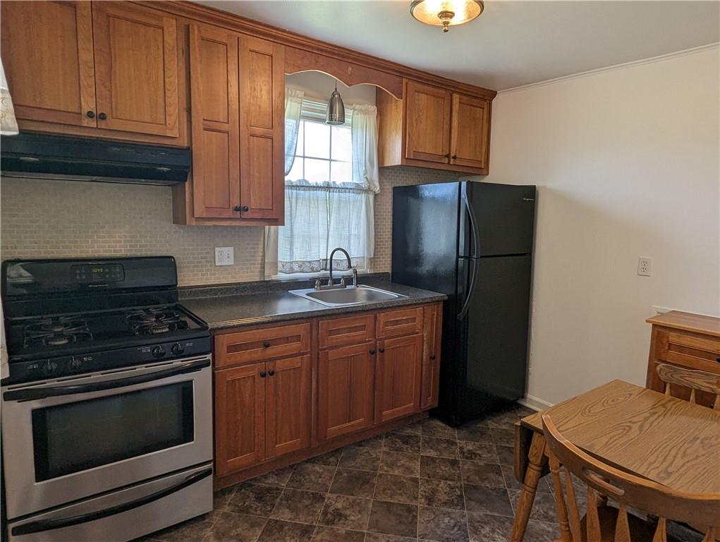 1154 Mars-Evans City Road Mars, PA 16046 - Photo 7 of 17 a kitchen with stainless steel appliances granite countertop a stove a refrigerator and a cabinets