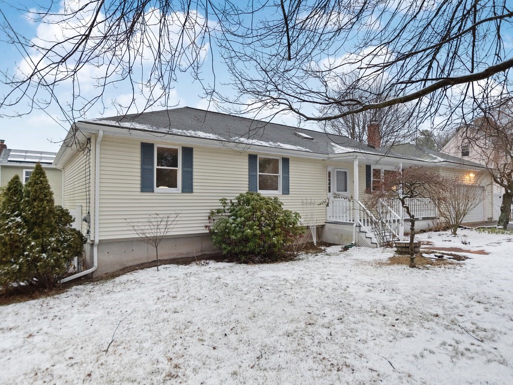 20 Indian Road Tewksbury, MA 01876 - Photo 1 of 30 a view of a house with a yard covered in snow