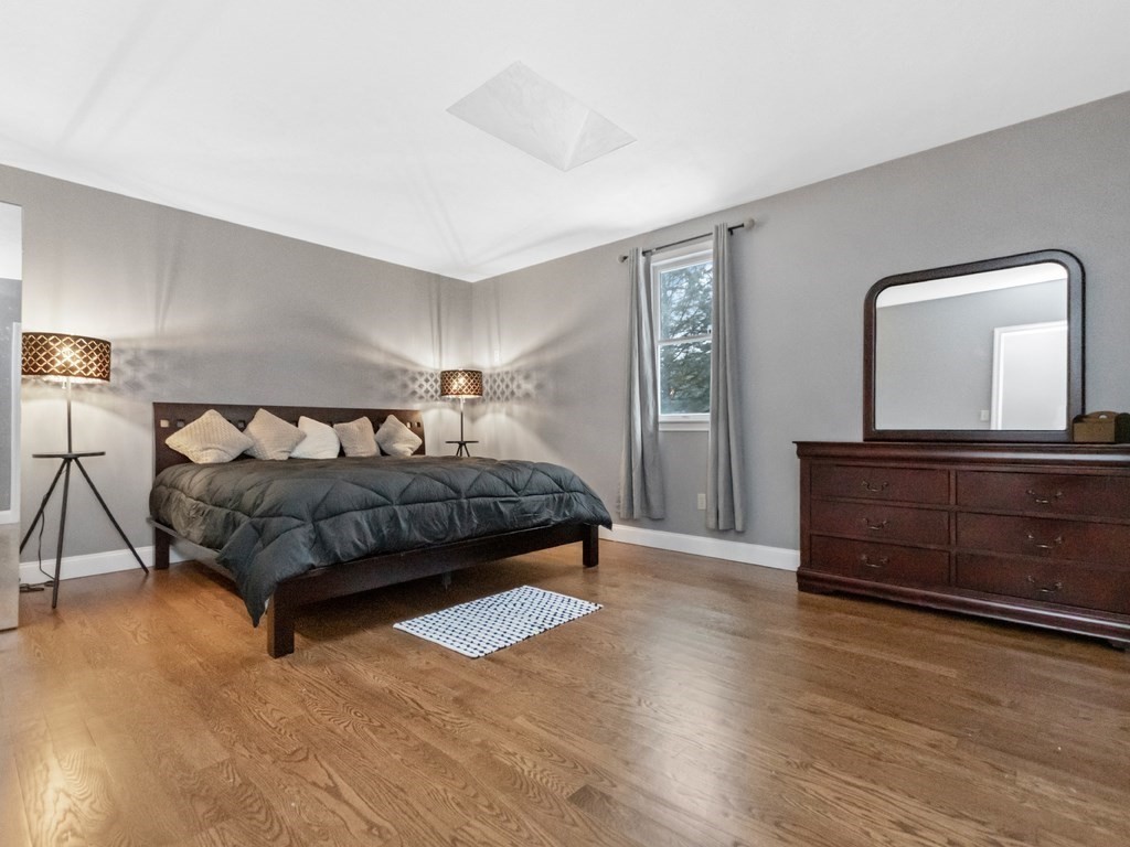 20 Indian Road Tewksbury, MA 01876 - Photo 12 of 30 a bedroom with a bed and a dresser