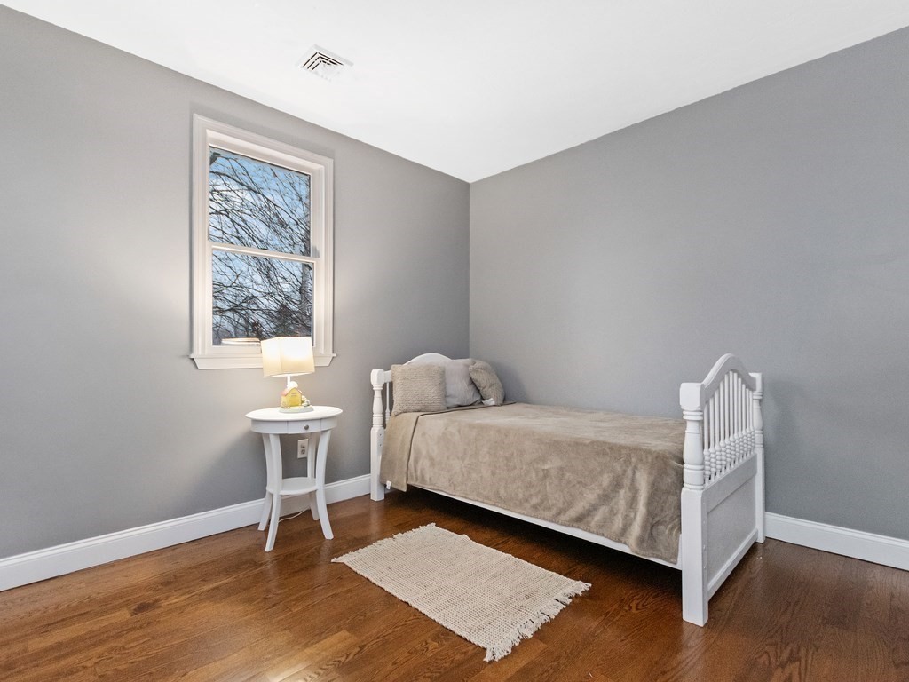 20 Indian Road Tewksbury, MA 01876 - Photo 14 of 30 a bed room with a bed and a chair