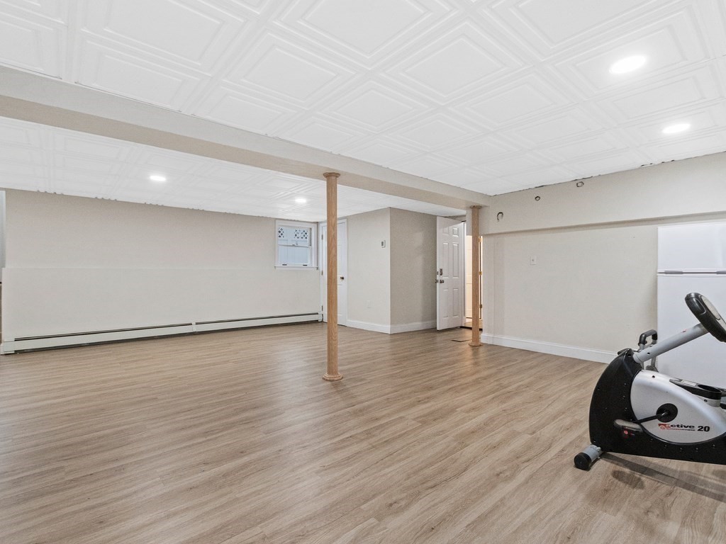 20 Indian Road Tewksbury, MA 01876 - Photo 21 of 30 a view of a room with gym equipment and wooden floor
