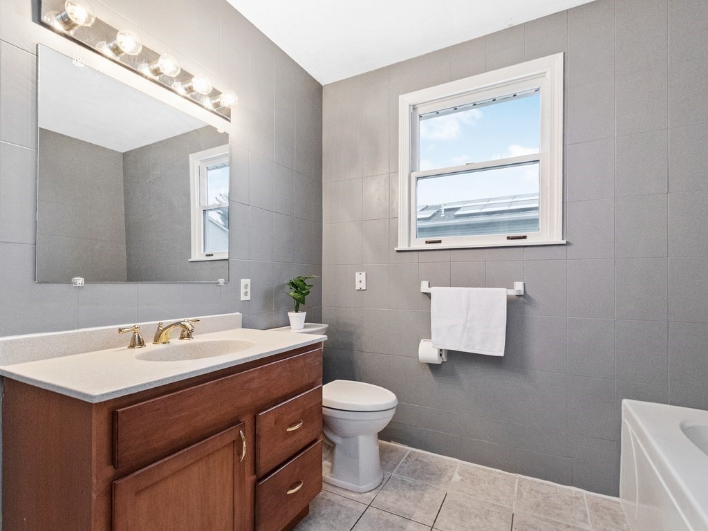 20 Indian Road Tewksbury, MA 01876 - Photo 23 of 30 a bathroom with a toilet sink and mirror