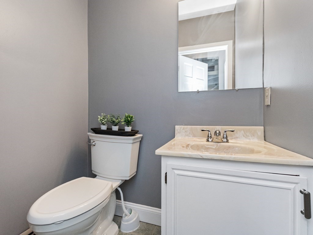 20 Indian Road Tewksbury, MA 01876 - Photo 25 of 30 a bathroom with a toilet sink and mirror