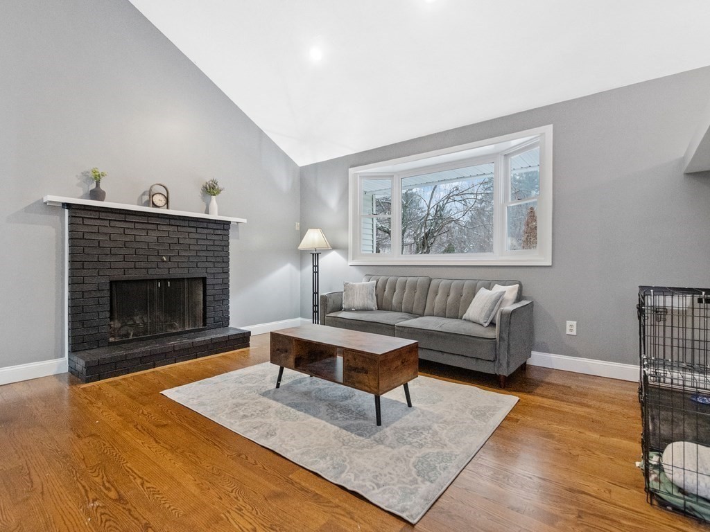 20 Indian Road Tewksbury, MA 01876 - Photo 5 of 30 a living room with furniture and a fireplace