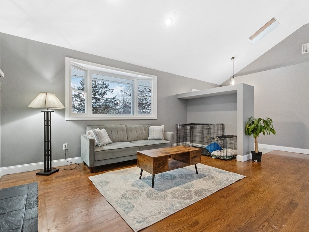 20 Indian Road Tewksbury, MA 01876 - Photo 6 of 30 a living room with furniture and a potted plant