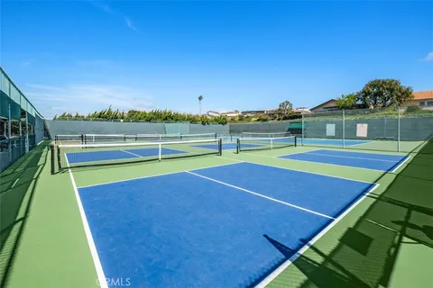 a view of an outdoor space and tennis court