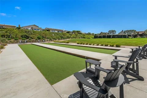 a view of a swimming pool and lounge chairs