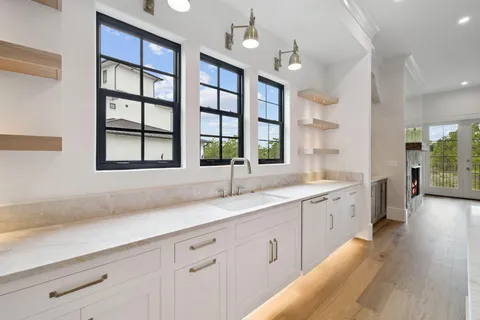 an empty room with windows and closet