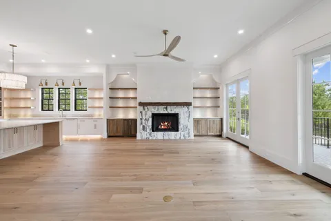 a view of a room with window wooden floor
