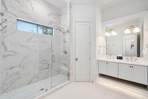 a kitchen with a stove and a wooden floor