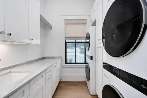 a large bedroom with a bed and a window