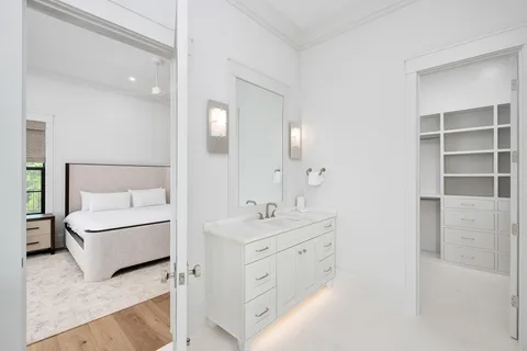 a view of a dining room with furniture wooden floor and chandelier