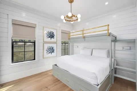 a view of a white building with a swimming pool