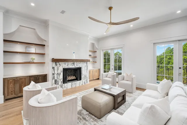 a living room with furniture fireplace and window