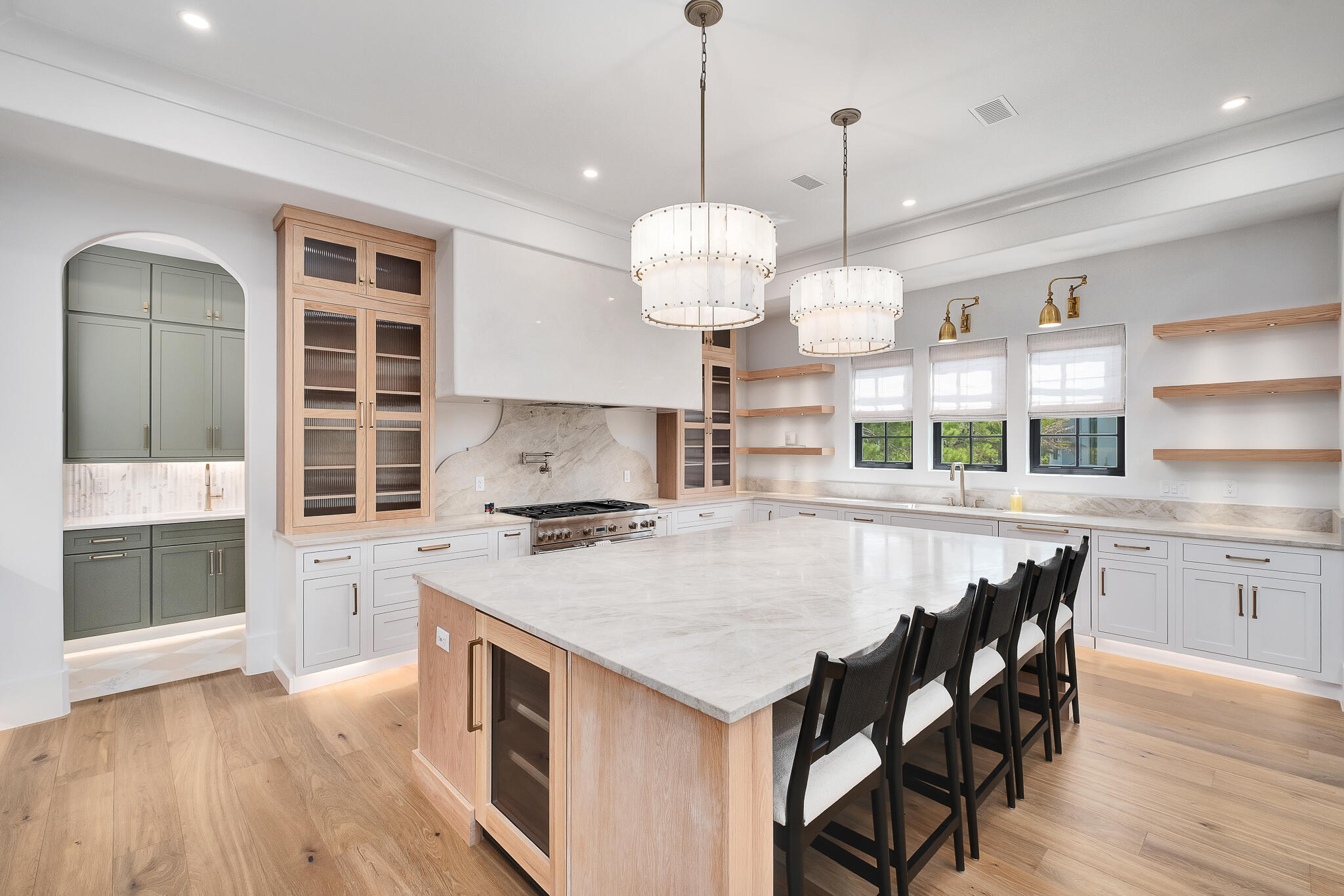 28 Loon Lake Drive Santa Rosa Beach, FL 32459 - Photo 10 of 23 a kitchen with stainless steel appliances granite countertop a stove a sink a refrigerator a dining table and chairs with wooden floor