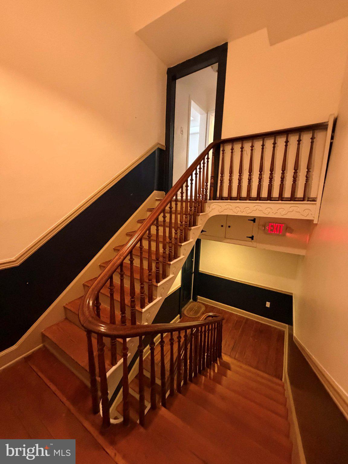 33 East 3rd Street Frederick, MD 21701 - Photo 3 of 16 Elegant curved staircase invites ascent.