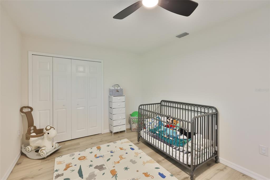 1578 Indian Bay Road Spring Hill, FL 34607 - Photo 33 of 51 a bedroom with furniture and a window