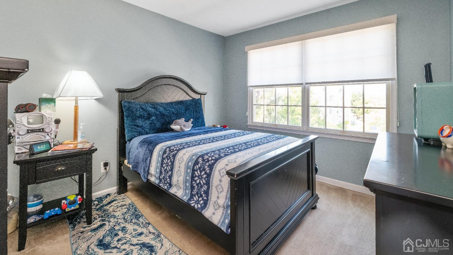1133 Edpas Road New Brunswick, NJ 08901 - Photo 16 of 26 a bedroom with a bed and a large window with the outer view