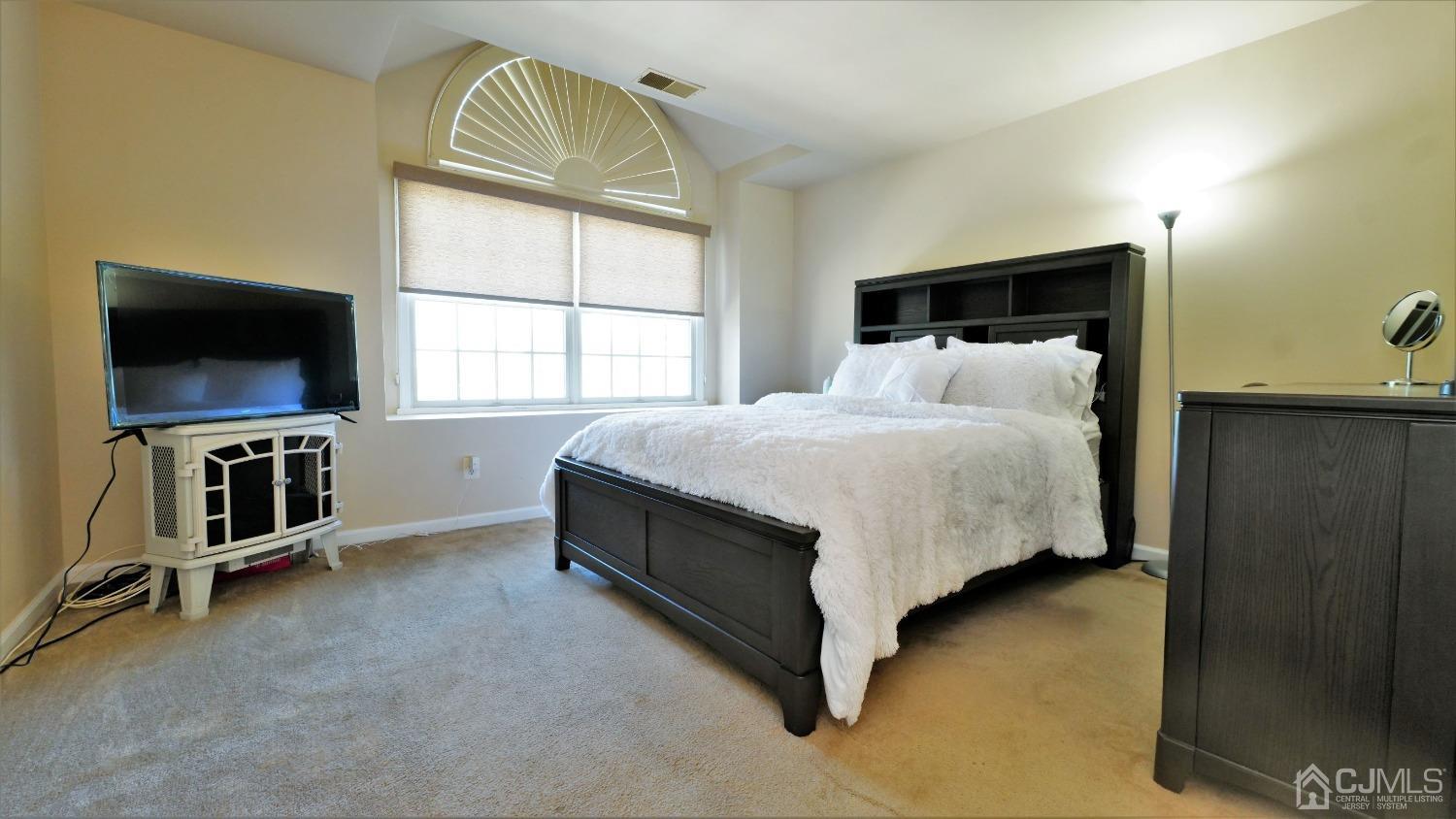 1133 Edpas Road New Brunswick, NJ 08901 - Photo 17 of 26 a bedroom with a bed and a tv