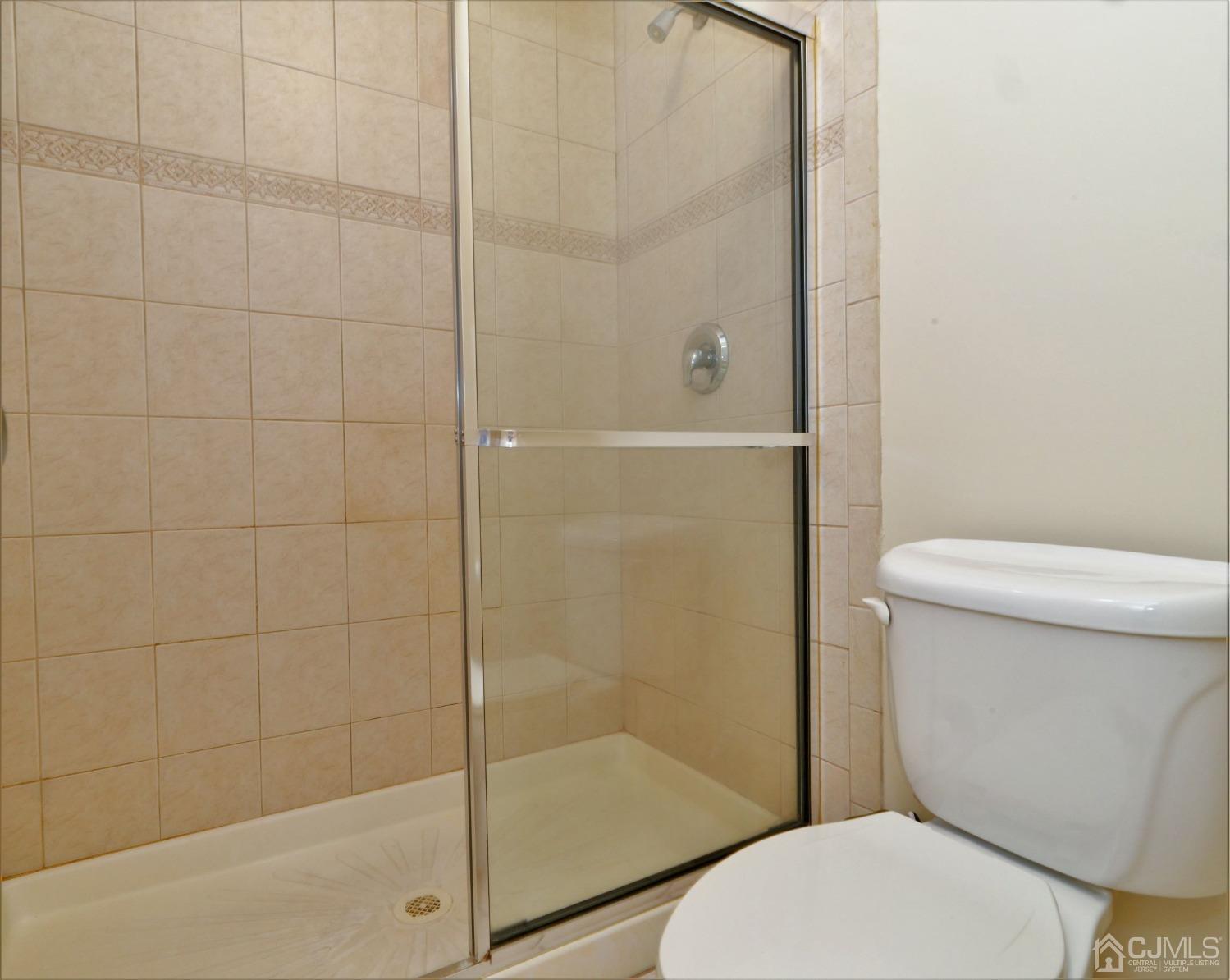 1133 Edpas Road New Brunswick, NJ 08901 - Photo 20 of 26 a white toilet sitting next to a bathroom