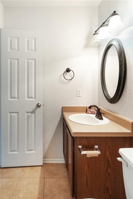 913 Cindy Lane Leander, TX 78641 - Photo 23 of 28 a bathroom with a sink a toilet and a mirror